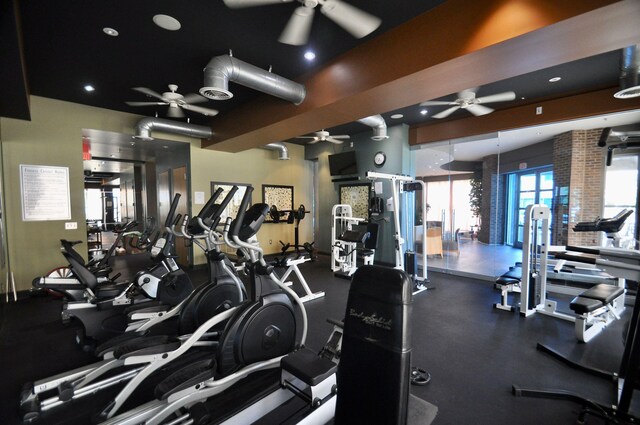 exercise room with ceiling fan