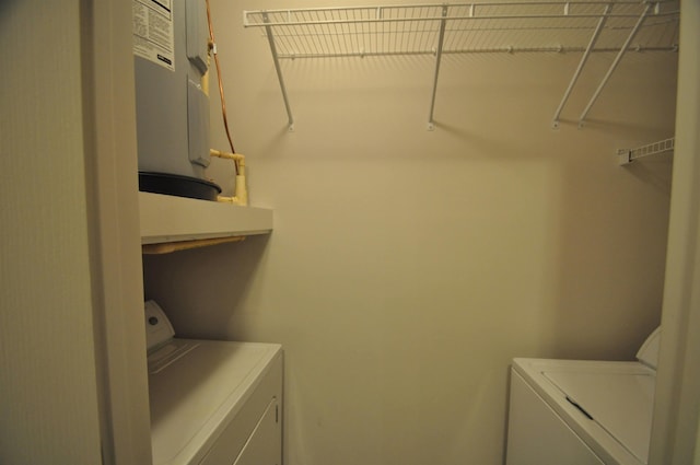 laundry area with separate washer and dryer and laundry area