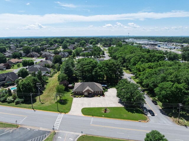  - drone / aerial view of a tree filled landscape