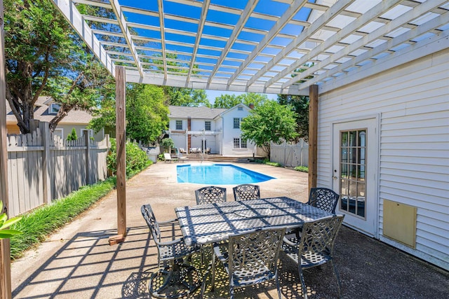  - view of pool featuring a pergola, a patio, and outdoor dining area
