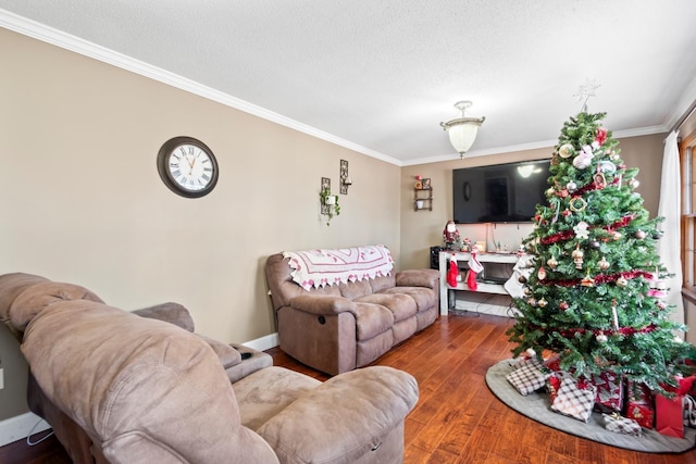 living room with hardwood / wood-style floors, a textured ceiling, and ornamental molding