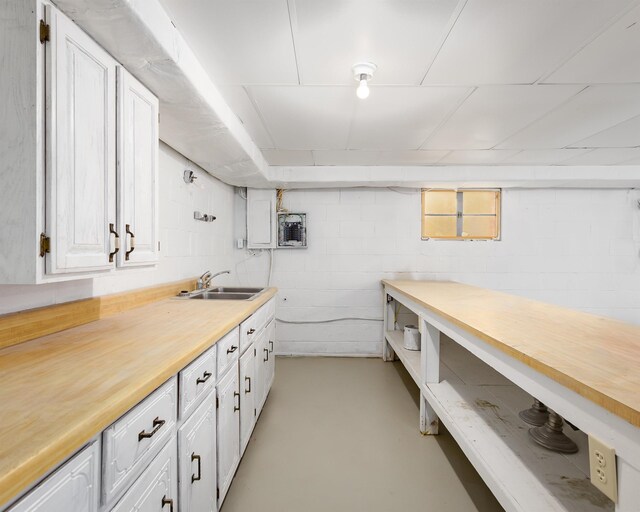 kitchen with white cabinetry and sink