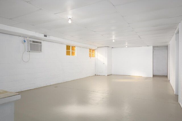 basement featuring an AC wall unit