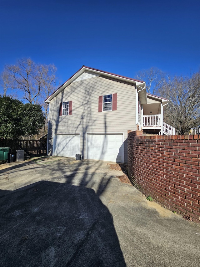 view of side of home with a garage