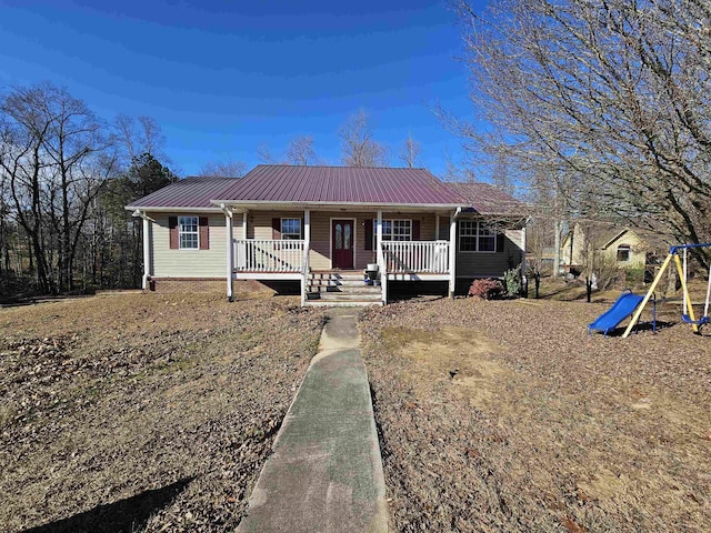 single story home featuring covered porch and a playground