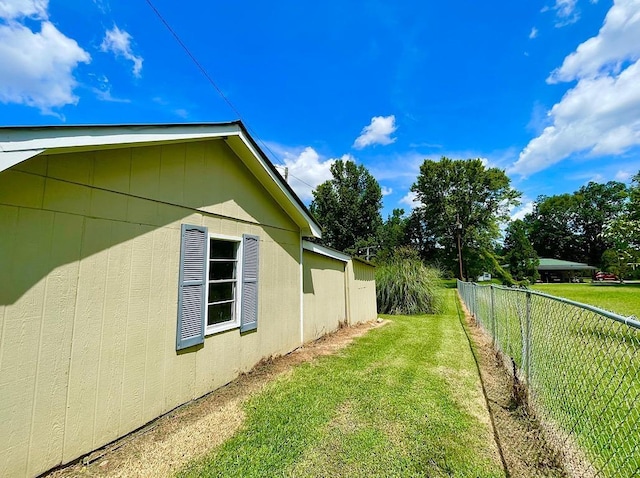 view of property exterior featuring a yard