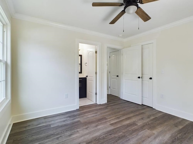 unfurnished bedroom with crown molding, ceiling fan, dark hardwood / wood-style flooring, and ensuite bath