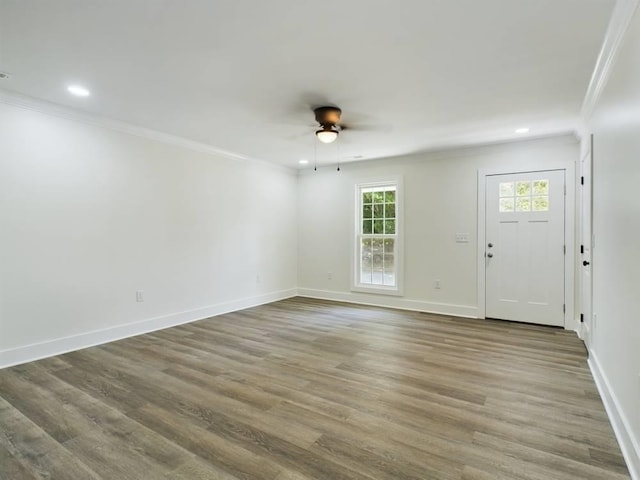 interior space featuring crown molding, hardwood / wood-style floors, and ceiling fan