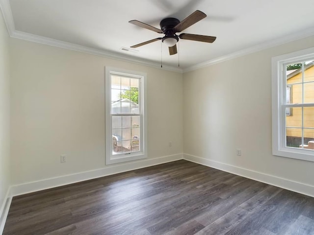 spare room with crown molding, dark wood-type flooring, and ceiling fan