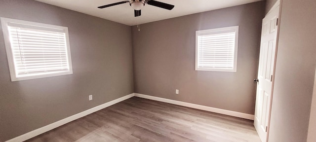 unfurnished room featuring hardwood / wood-style flooring and ceiling fan