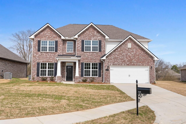 view of front of home with a front lawn, an attached garage, brick siding, and driveway