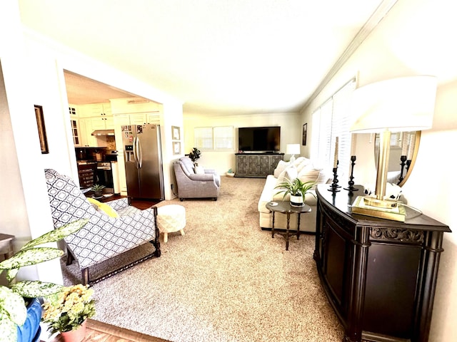 living room with crown molding and light carpet