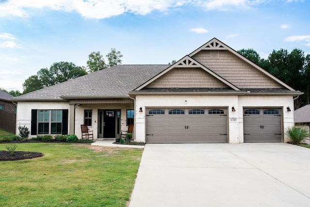 craftsman-style home featuring a front yard and a garage