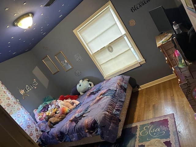 bedroom featuring hardwood / wood-style floors