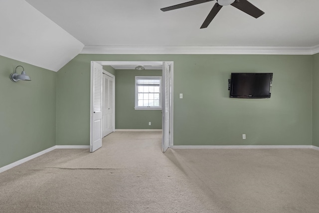  - additional living space featuring ceiling fan, carpet floors, baseboards, and lofted ceiling