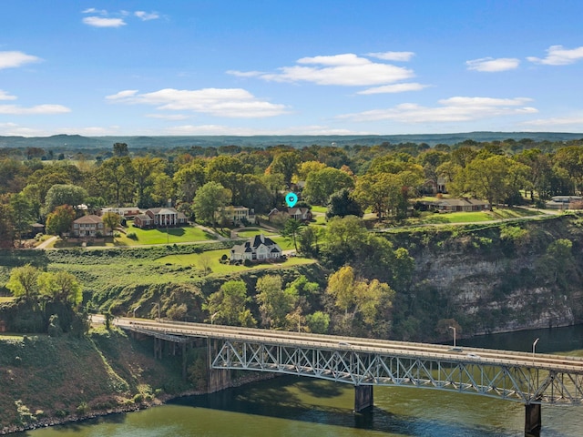  - aerial view of property and surrounding area featuring a notable bridge and a nearby body of water