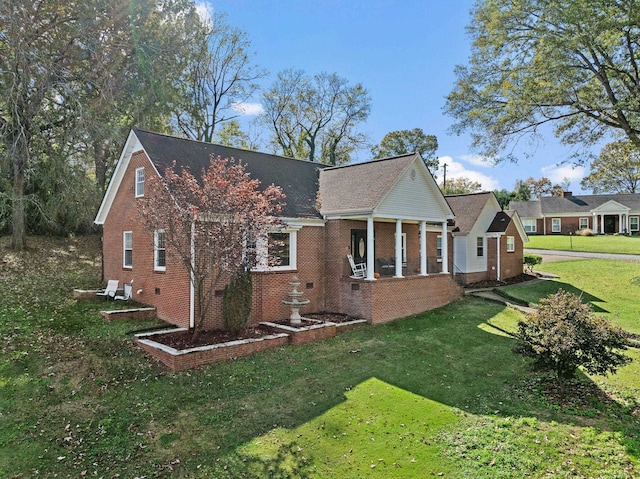 view of property exterior featuring a porch and a lawn