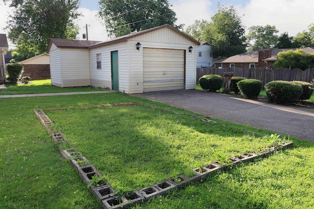 garage with a lawn