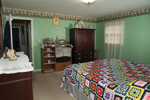 bedroom featuring a textured ceiling and carpet floors