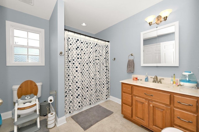 bathroom featuring tile patterned floors, vanity, and a shower with shower curtain