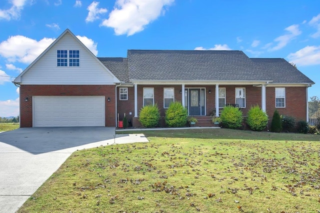 view of front of property featuring a garage and a front lawn