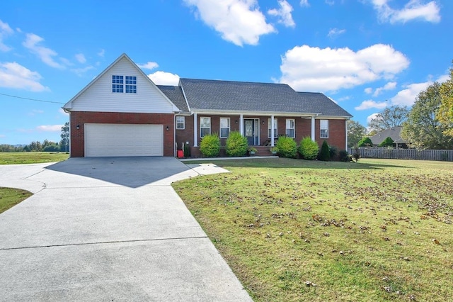 view of front of home featuring a front yard, a porch, and a garage