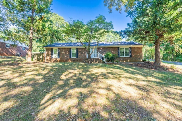 ranch-style house with a front yard