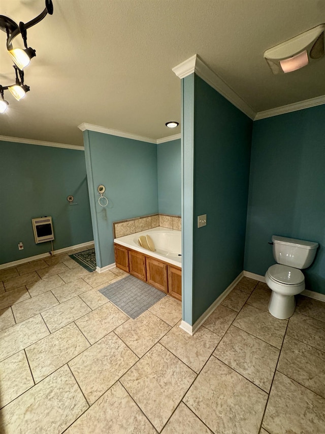 bathroom with toilet, crown molding, a tub, and heating unit