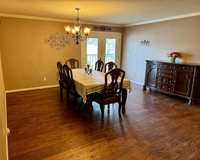 dining area with french doors, dark hardwood / wood-style flooring, an inviting chandelier, and crown molding