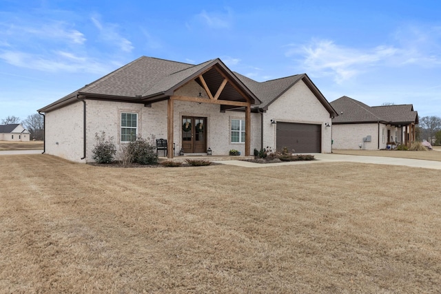 view of front facade with a garage and a front yard