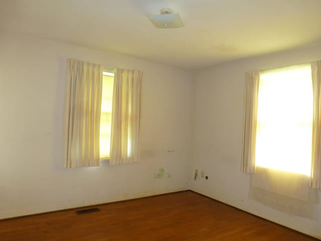  - empty room with wood finished floors