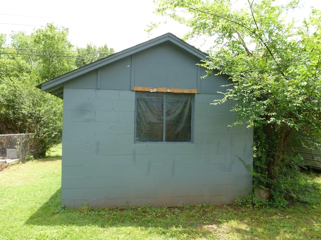  - view of property exterior with concrete block siding