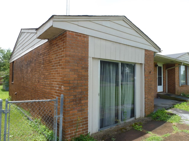  - view of side of property featuring brick siding