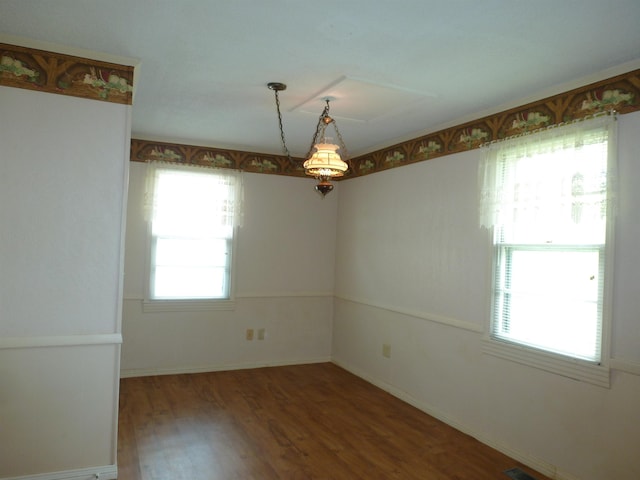  - empty room with wood finished floors and baseboards