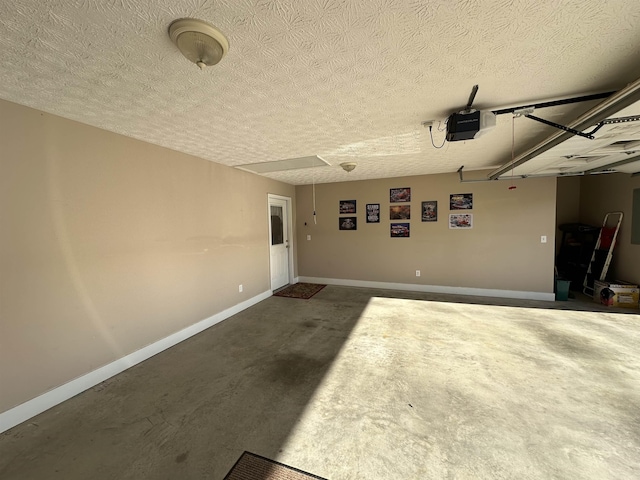 garage featuring baseboards and a garage door opener