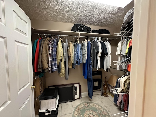 walk in closet featuring tile patterned floors