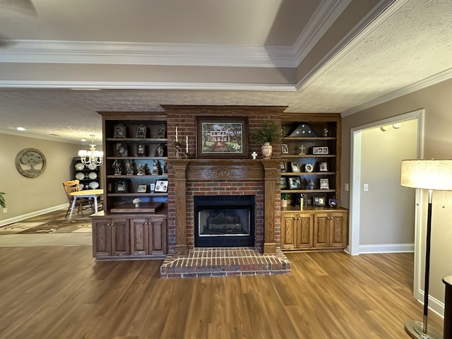 living area featuring a fireplace, ornamental molding, baseboards, and dark wood-style floors
