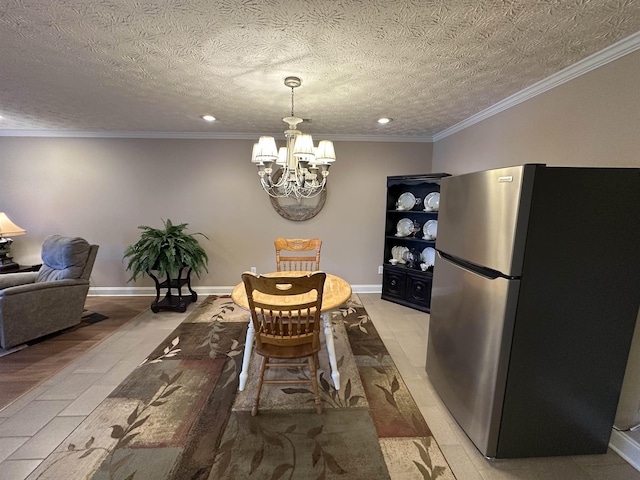 dining space featuring crown molding, an inviting chandelier, and recessed lighting