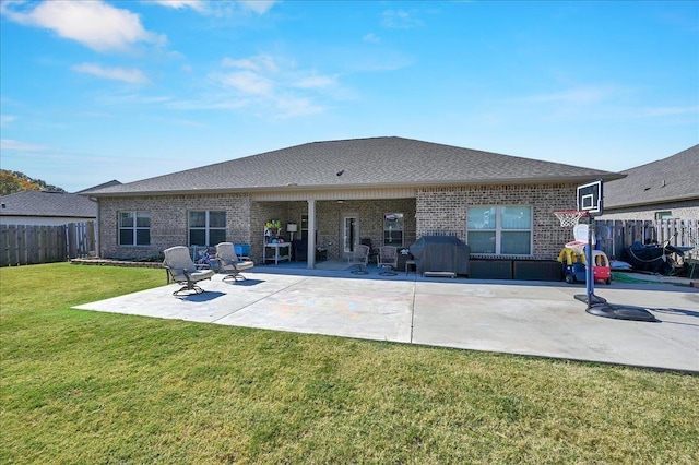 rear view of house with a yard