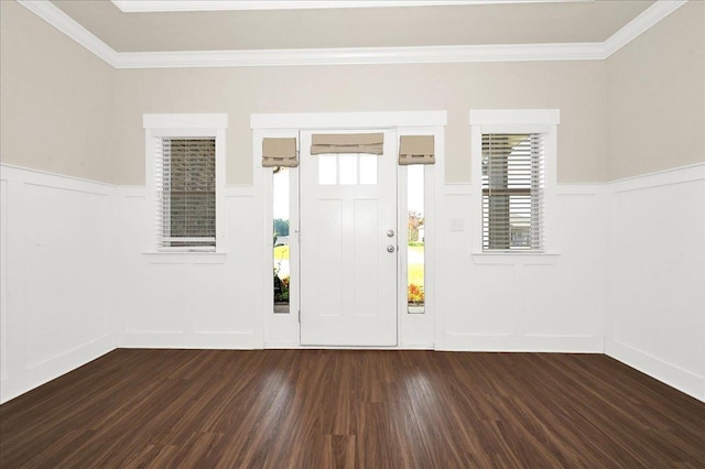 foyer with crown molding and dark wood-type flooring