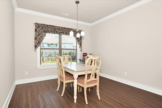 dining space with crown molding, dark wood-type flooring, and a notable chandelier