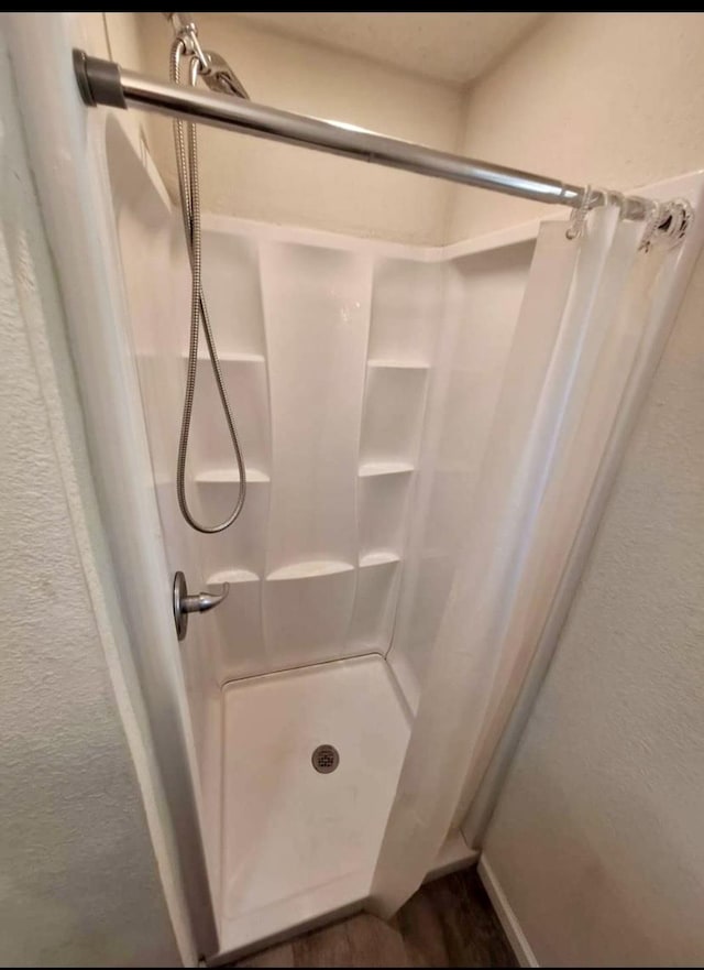 bathroom with a shower with curtain