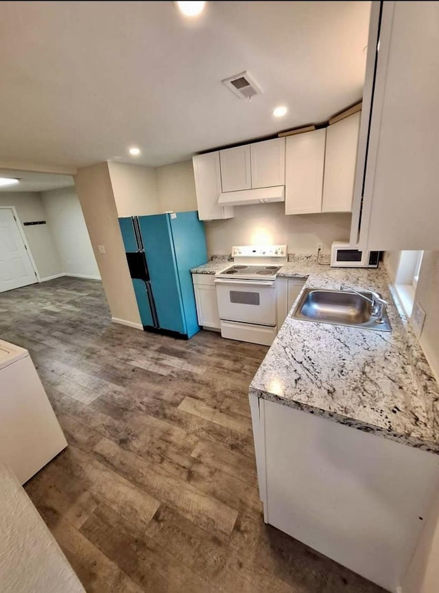 kitchen with hardwood / wood-style floors, white range with electric cooktop, white cabinets, sink, and fridge with ice dispenser