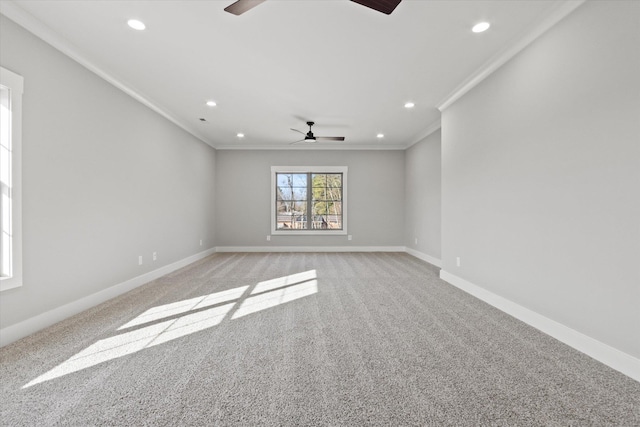 unfurnished room featuring ornamental molding, light carpet, and ceiling fan