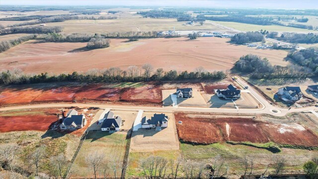 birds eye view of property with a rural view