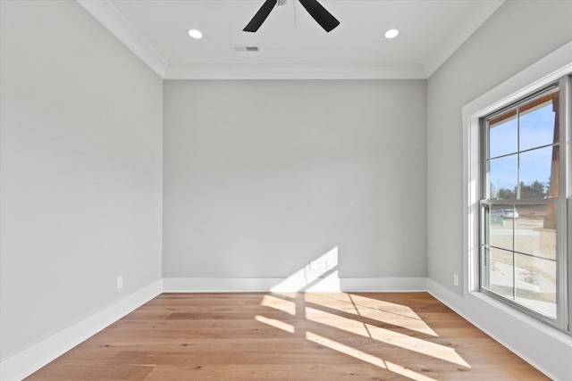 unfurnished room with crown molding, ceiling fan, and light wood-type flooring