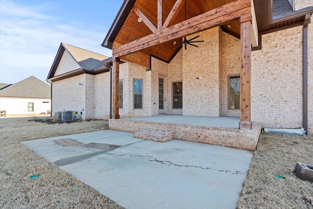 back of property with central AC unit, a patio, and ceiling fan