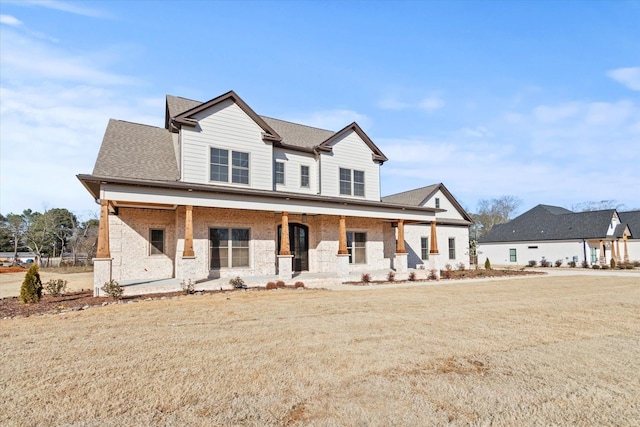 view of front of home with a front lawn and a porch