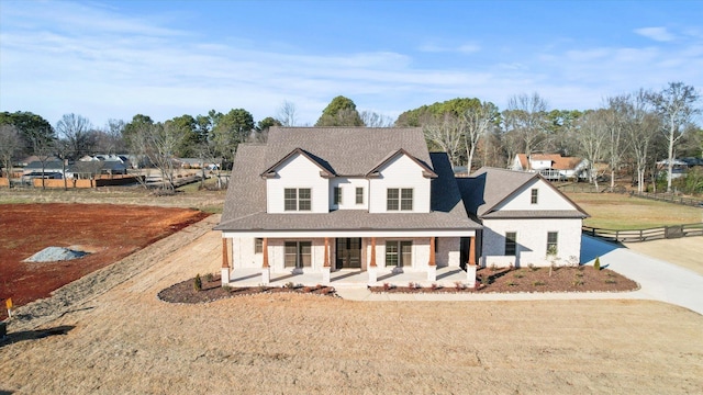 view of front of home featuring a porch and a front yard