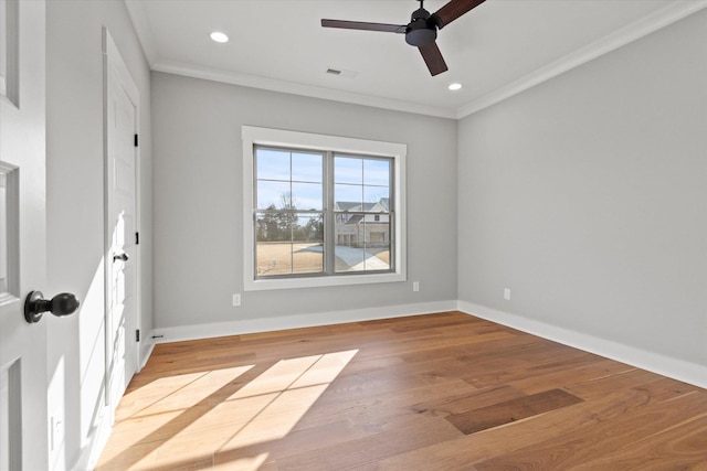 empty room with crown molding, ceiling fan, and light wood-type flooring